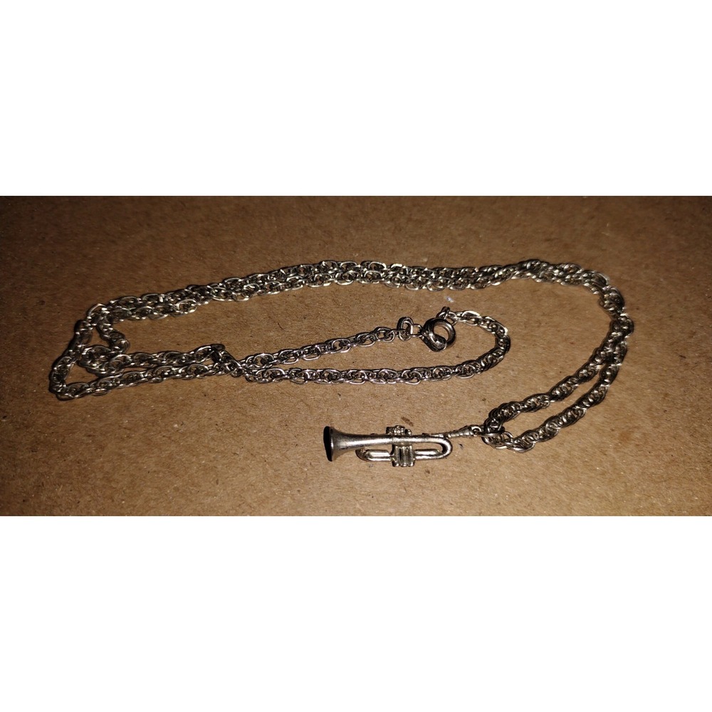 Silver Musical Instrument With Chain